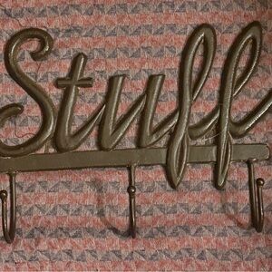 CAST IRON 3 HOOK WALL HANGIN READS “STUFF”